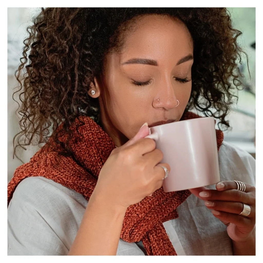 woman drinking from mug