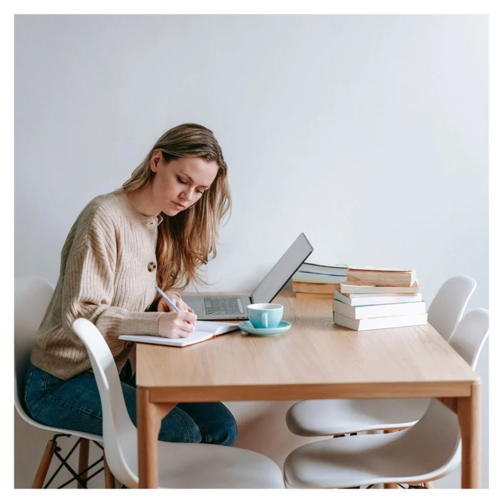 woman working at a kitchen table