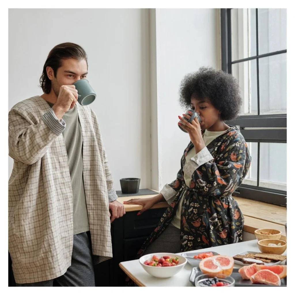 couple in a kitchen drinking tea